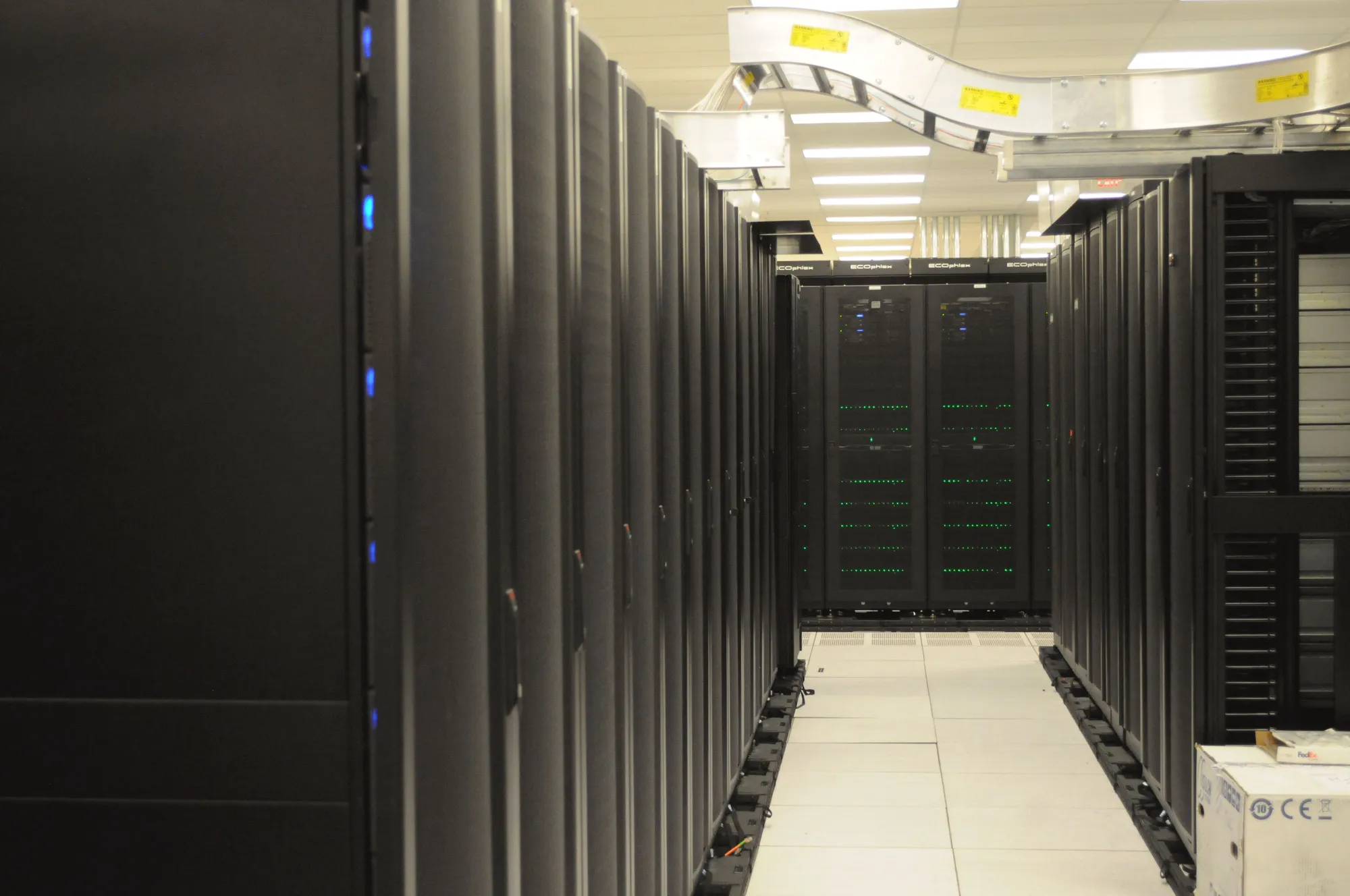 A corridor of server racks in a data center.
